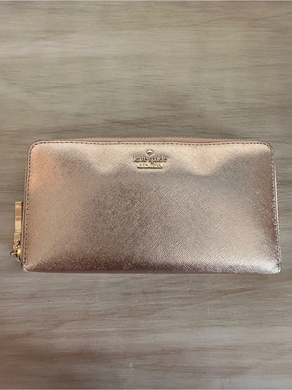 kate spade metallic rose gold zip-around wallet with logo